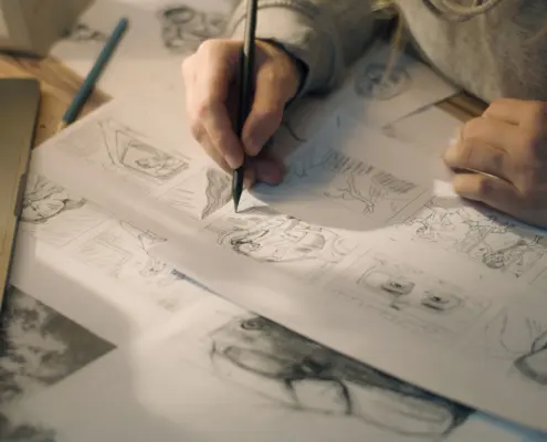 Person handwriting storyboards