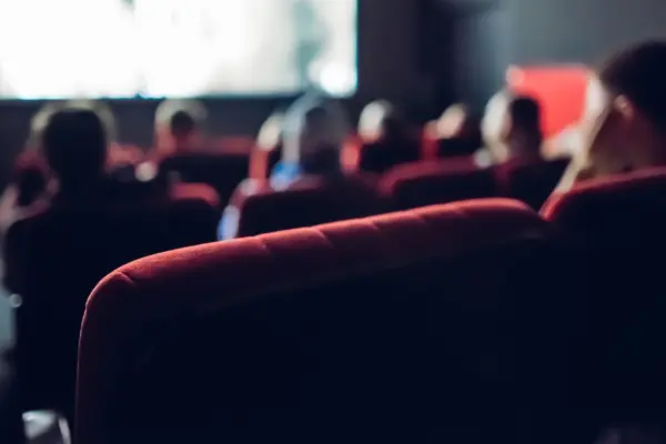 People watching a Film in a Movie Theater