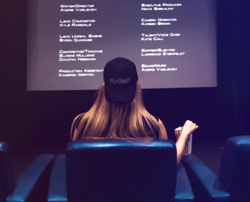 Woman with Hat watching movie credits