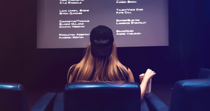 Woman with Hat watching movie credits