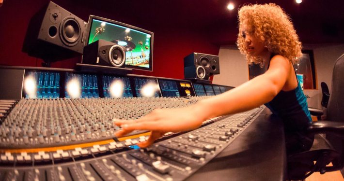 Woman at a recording console