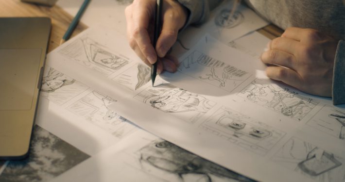 Person handwriting storyboards