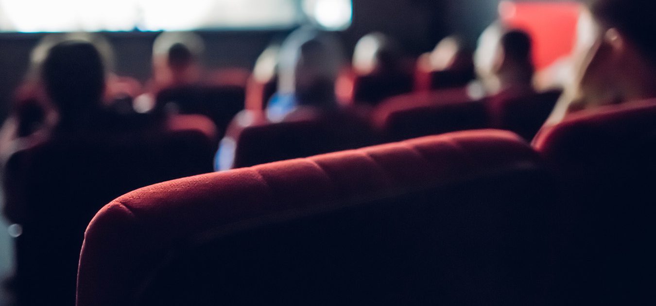 People watching a Film in a Movie Theater