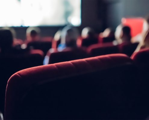 People watching a Film in a Movie Theater