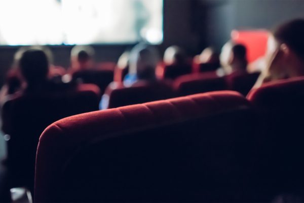 People watching a Film in a Movie Theater