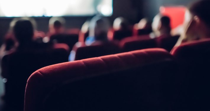 People watching a Film in a Movie Theater