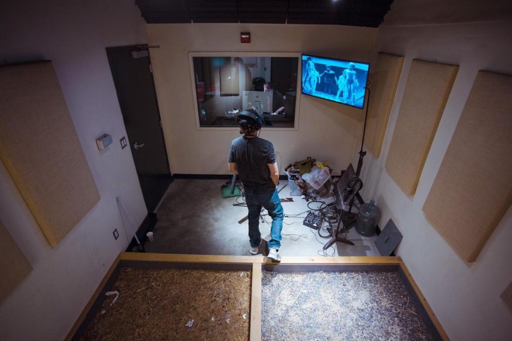 Man looking at screen recording foley